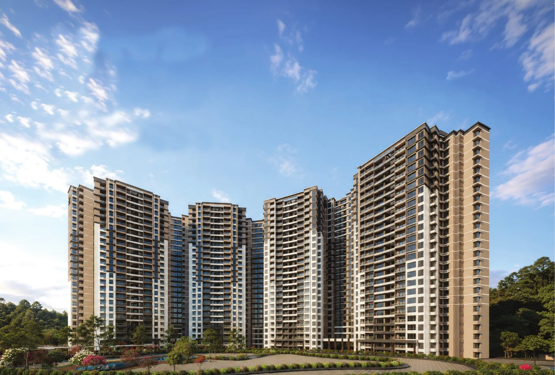Prestige Parklane residential towers rising above landscaped gardens under a blue sky, KIADB Aerospace Park Phase 2, Devanahalli