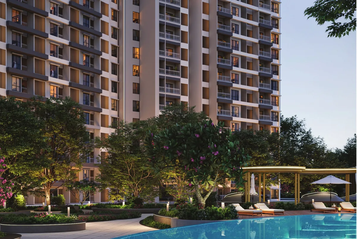 Prestige Parklane pool deck with cabanas and loungers below the towers at dusk